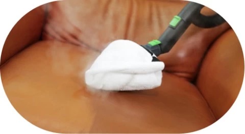 Steam cleaning a sofa