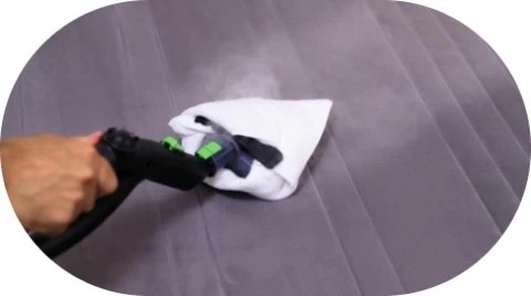 Steam cleaning a mattress